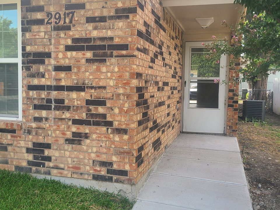 Entrance with a fresh concrete walkway