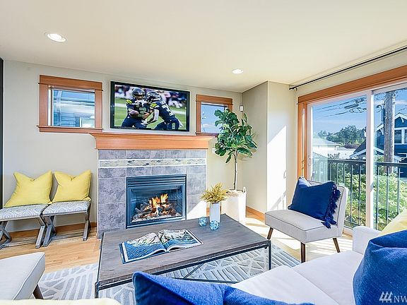 Light filled Living Room next to sliding door with juliette balcony