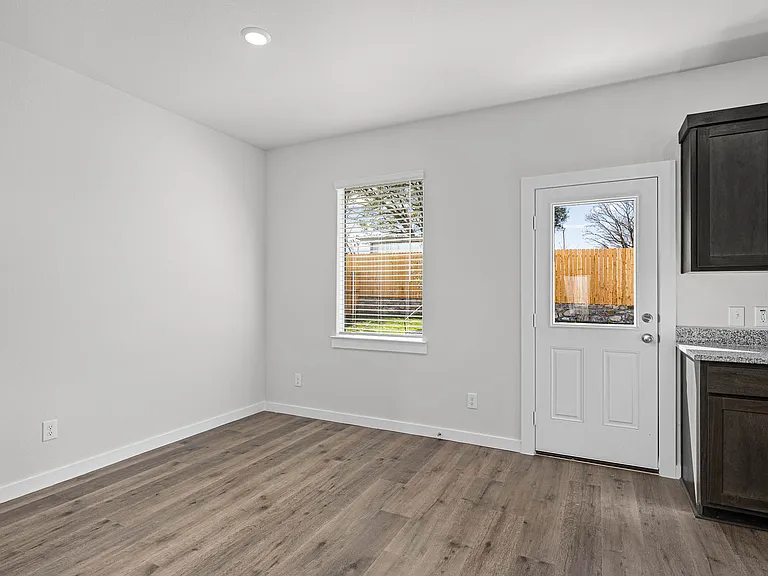 The dining room has a large window that lets in great, natural light.