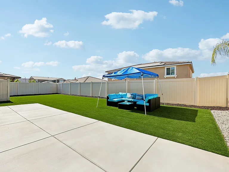 Enjoy a private backyard complete with a BBQ and comfortable outdoor furniture.