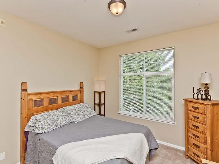 Master bedroom with walk in closet and bathroom