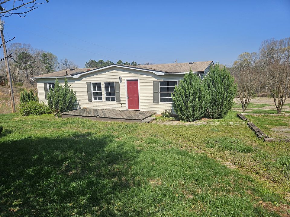 Sunny front porch entrance, parking for three vehicles easy, large storage barn is yours.