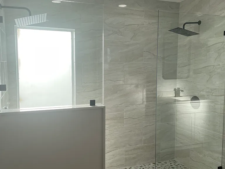 walk-in shower with dual shower heads on each side