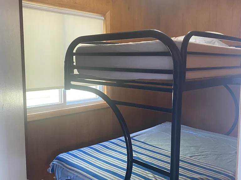 Looking into bedroom#1: full size bed with twin bunk above.Memory foam mattresses, fully furnished with sheets, blankets ,extra linens.
