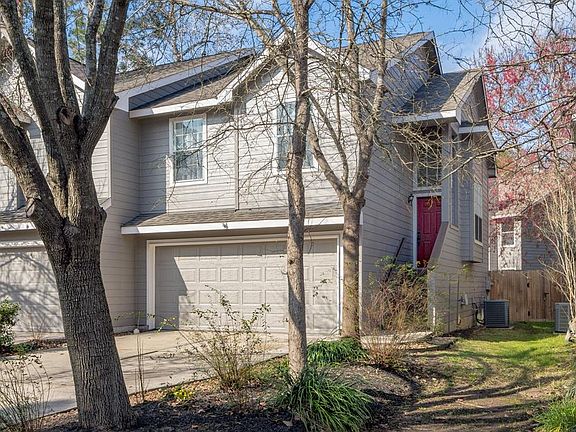 Great curb appeal, two car attached garage and lovely red door to greet guests.