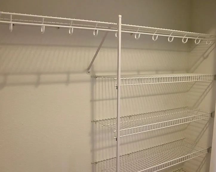 Hall closet - plenty of storage for coats and linens