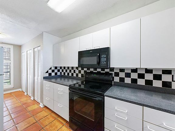 Kitchen has large pantry for plenty of storage.