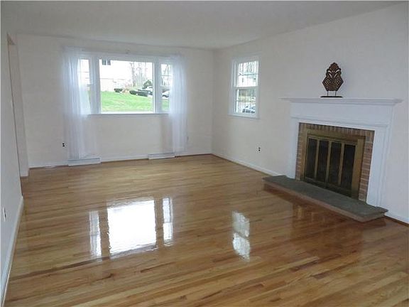Living room with woodburning fp