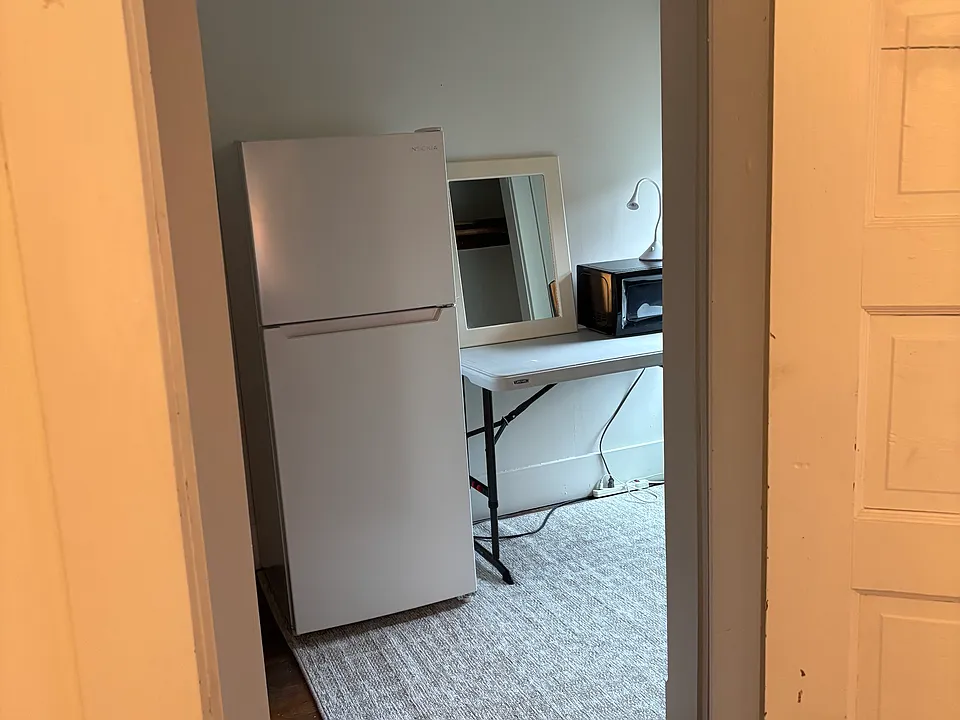 side room with refrig and microwave