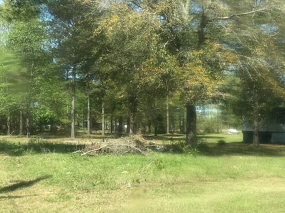 SW corner by power pole