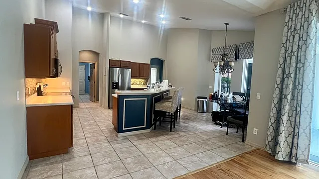 Spacious kitchen, breakfast nook, that flows into the family room. Enjoy holidays, family event, and more in this large gathering space. Window treatments for convenience only.