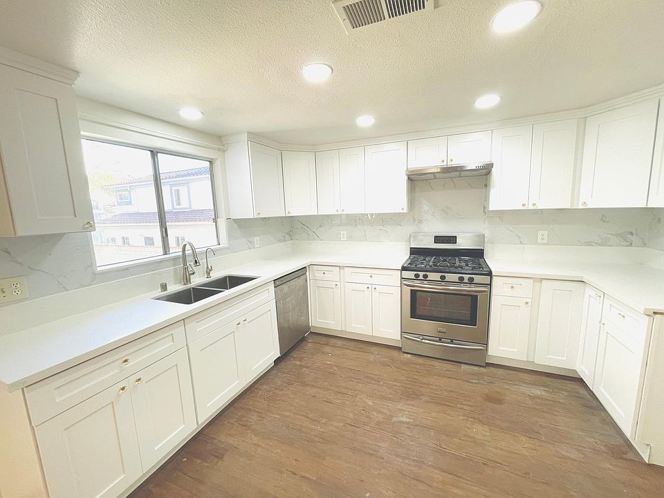 Newly remodeled kitchen, new cabinets, new counters new kitchen, new backsplash , new cooking vent, new ceiling lights, Stove and dishwasher is as is. Stove works. Bring your own refrigerator