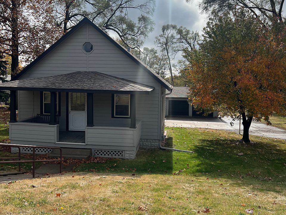 Freshly painted! 1 acre lot and detached 2 car garage.