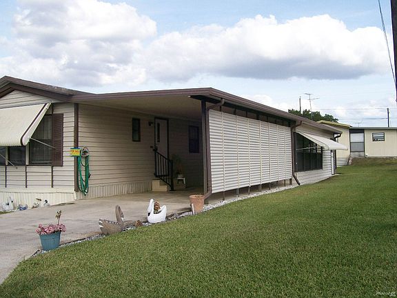 Car Port Partially Enclosed for Privacy