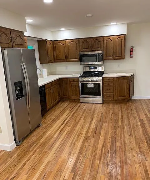 Kitchen with Brand New Appliances and Gas Stove