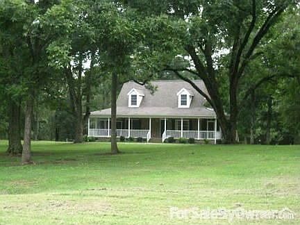 Beautiful yard has huge pecan trees and over 2 acres