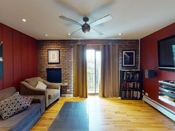 Living Room with fireplace and balcony