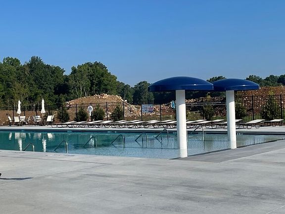 Awesome neighborhood zero entry pool with waterfall mushrooms and plenty of room to relax and enjoy