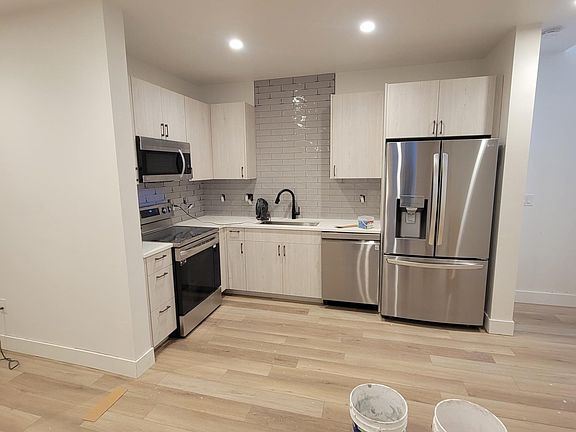 Great kitchen with high end appliances including a dishwasher and electric stove. New photos coming soon.