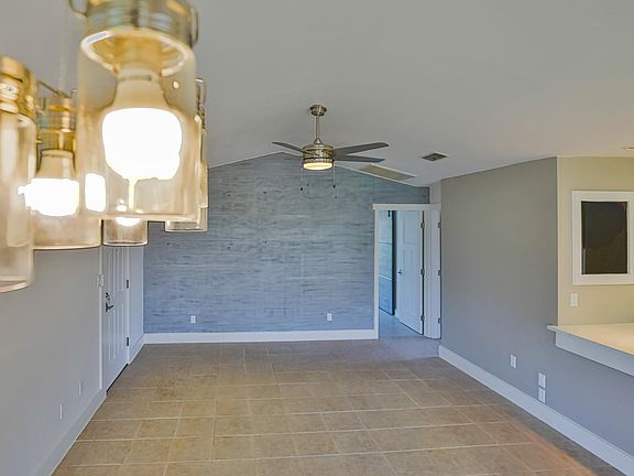 Large living room with coastal weathered wood accent wall