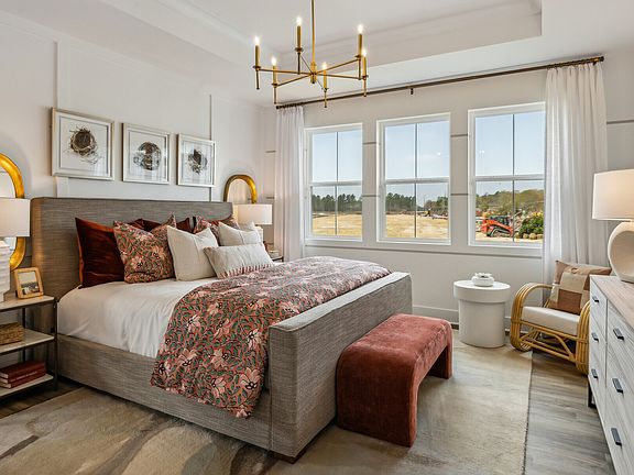 Primary suite with decorative feature wall