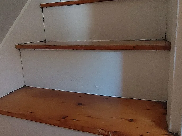 Steep, narrow stairs. Most furniture will not fit.