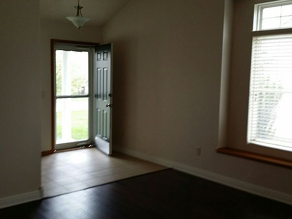 Tiled entry and wood flooring in great room