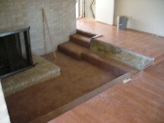 Sunken seating makes cozying up the fireplace a real pleasure