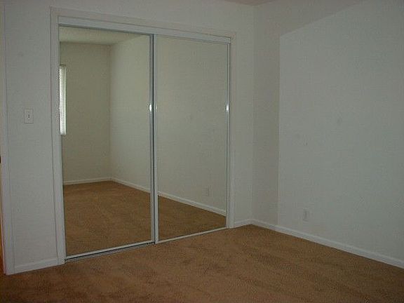 The bedrooms have new mirror closet doors.