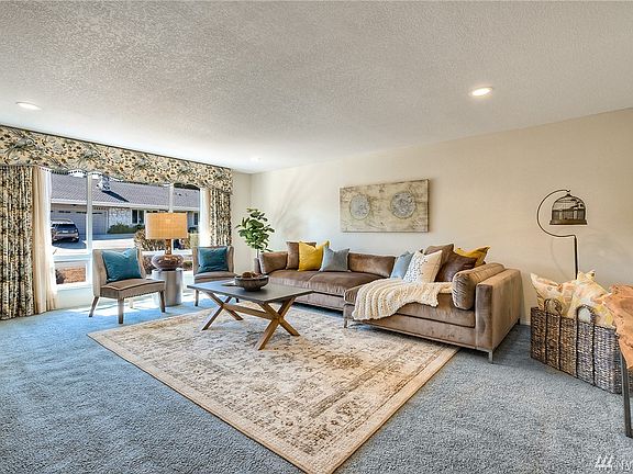 Front living room is large and filled with light. 