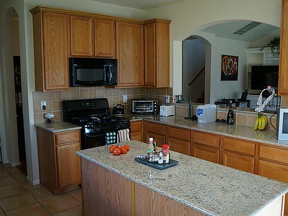 Another view of the kitchen  which is open to the family room.