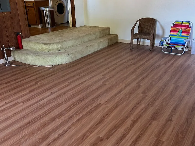 Livingroom entry to kitchen and shared laundry room