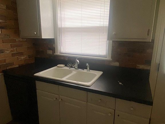 Kitchen - Sink above window overlooks shared backyard