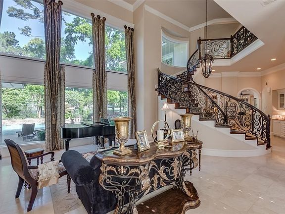 Designed & constructed by Tommy Bailey, an established & prestigious custom home builder in The Woodlands, this estate has been lovingly maintained & thoughtfully updated by the current owners.