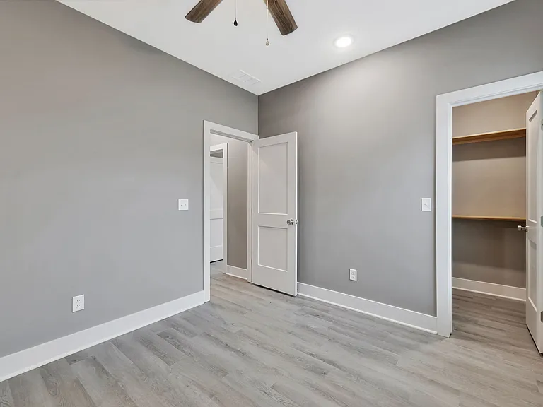 Primary bedroom with walk in closet