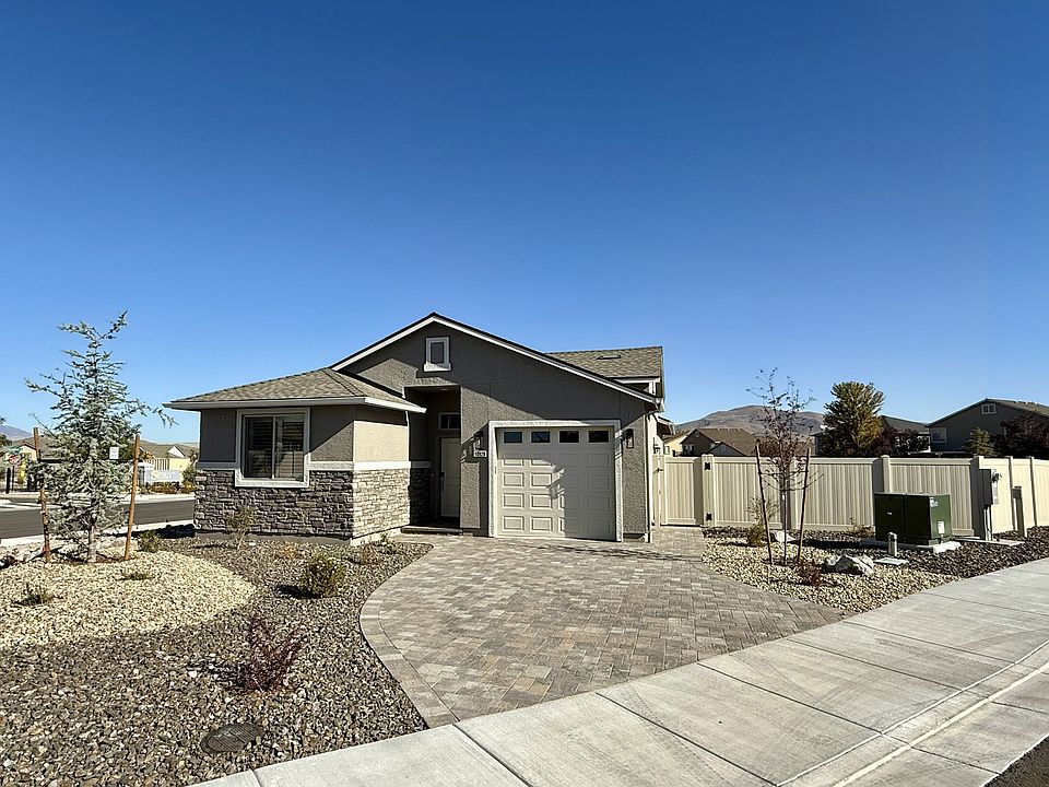 Upscale stone features and paver driveway. Large corner lot.