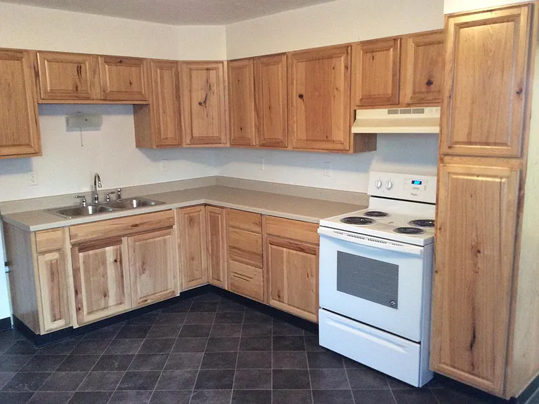 Kitchen with new floor, sink, counter top, some new cabinets