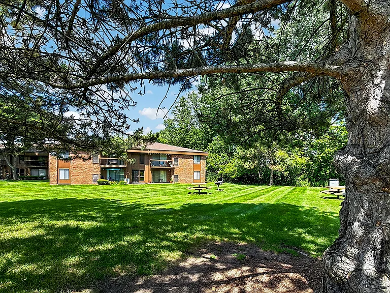Expansive green space and picnic area at Eastwood Village Apartments in Clinton Township, MI.