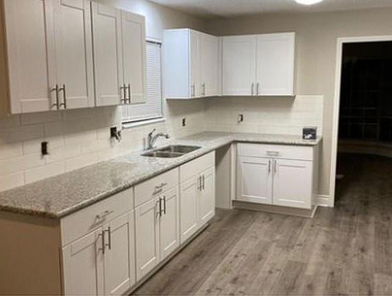 Sample image of large eat-in kitchen with updated cabinets and countertop