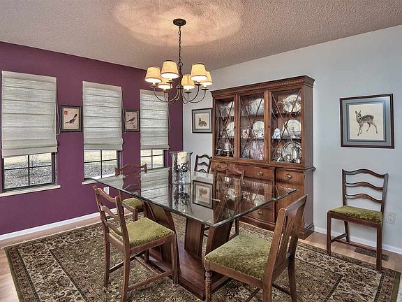 The formal dining area is just off the kitchen and open to the formal living roo