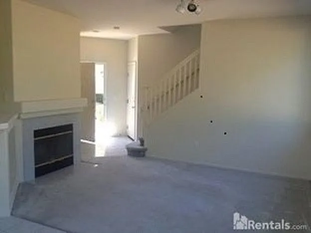 Family room showing main entrance and stairs