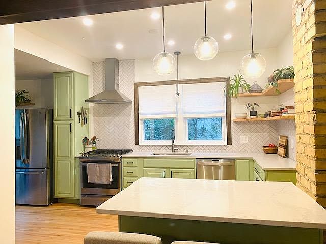 Newly remodeled open concept kitchen with island and all new appliances.