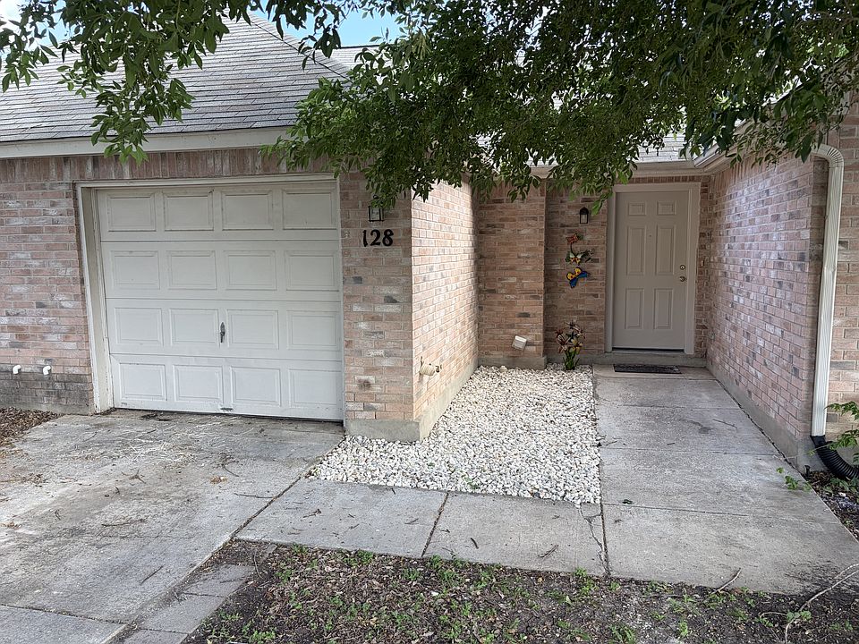 Single car garage and driveway, entry courtyard and front door