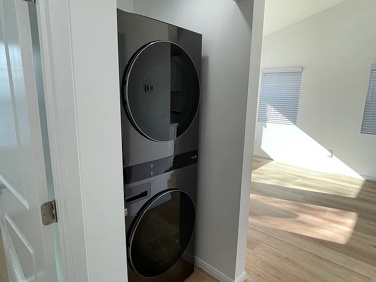 In-unit washer and dryer with space-saving stacked design for added convenience.