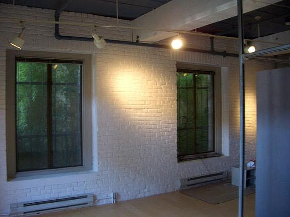 North windows look into a bamboo-filled green space.