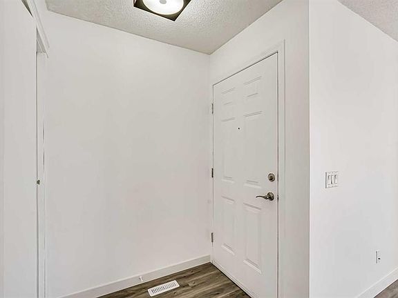 5th image of 163 W Saddlemont Cres NE