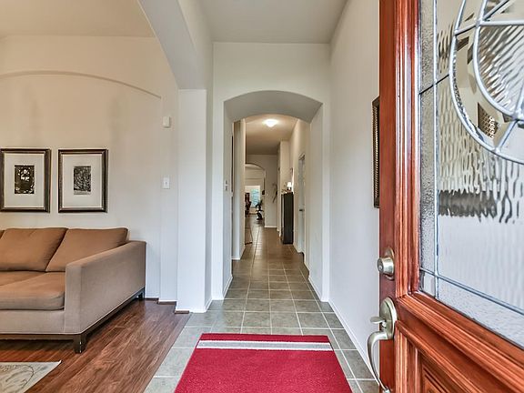 Open the door, and step into the tiled foyer.  The formal dining is on the left.