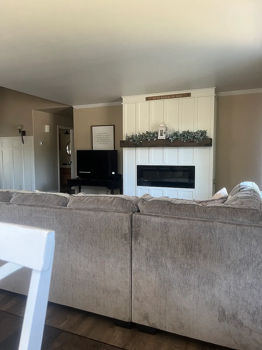 Updated living room, electric fireplace, lvp flooring. - 916 Marian Dr