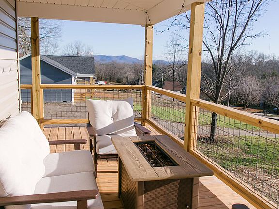 A favorite spot to enjoy coffee or a cocktail next to a propane fire table that overlooks the blue ridge mountains