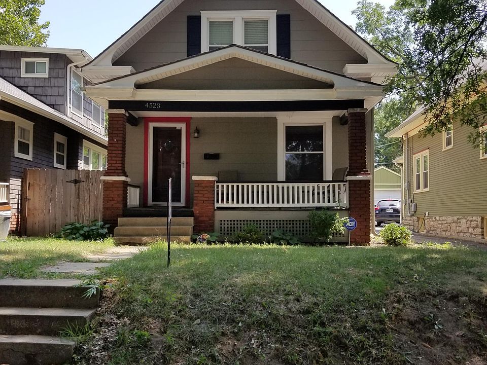 Front of house from sidewalk -- patio furniture included